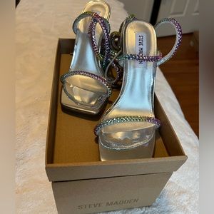 Uplift multi colored high heels only worn once. Selling with box